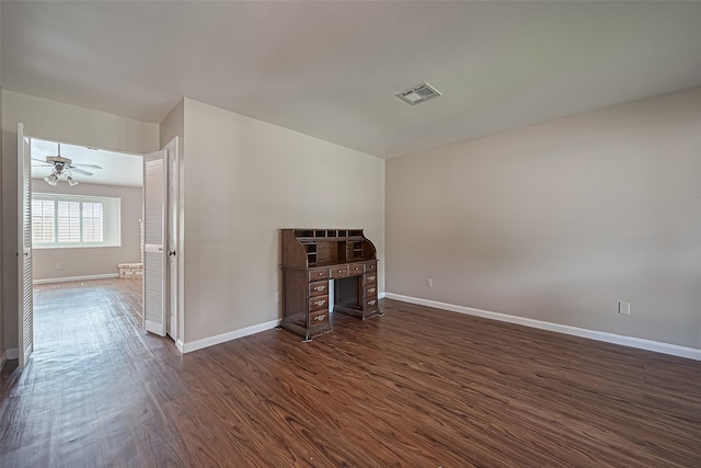22303 Walnut Valley Dr, Spring, TX 77389 - unfurnished living room featuring dark wood-style flooring and ceiling fan