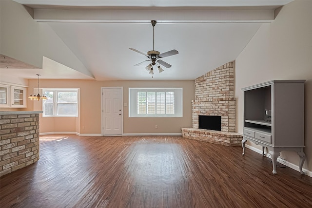 22303 Walnut Valley Dr, Spring, TX 77389 - unfurnished living room with a chandelier, a brick fireplace, ceiling fan, plenty of natural light, and high vaulted ceiling