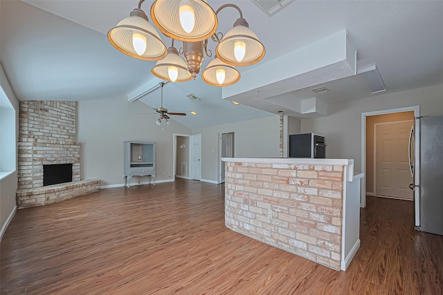22303 Walnut Valley Dr, Spring, TX 77389 - kitchen with freestanding refrigerator, a ceiling fan, wood finished floors, a brick fireplace, and open floor plan