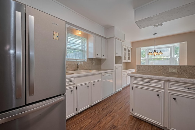 22303 Walnut Valley Dr, Spring, TX 77389 - kitchen with freestanding refrigerator, dishwasher, tile counters, dark wood-style floors, and white cabinets