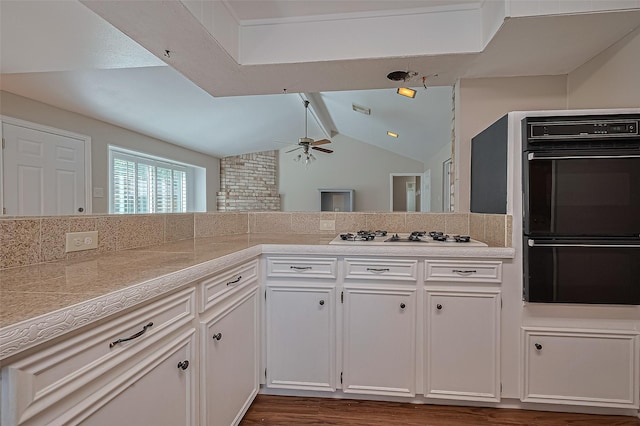 22303 Walnut Valley Dr, Spring, TX 77389 - kitchen featuring white gas cooktop, ceiling fan, dark wood finished floors, white cabinets, and tile counters