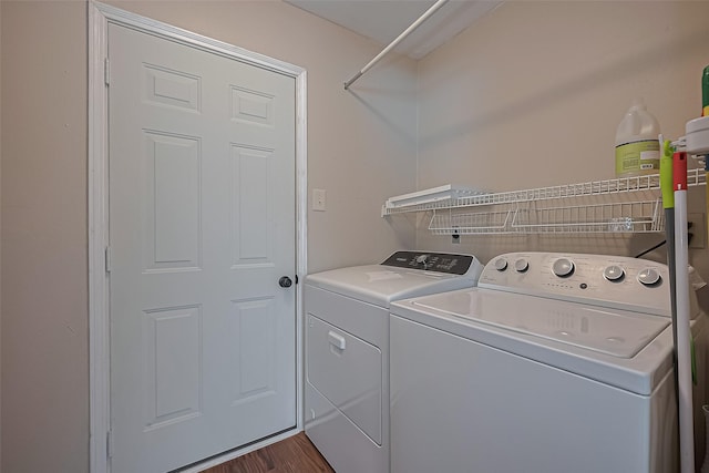 22303 Walnut Valley Dr, Spring, TX 77389 - washroom with separate washer and dryer and dark wood-style flooring