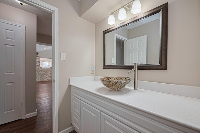 22303 Walnut Valley Dr, Spring, TX 77389 - bathroom featuring vanity and wood finished floors