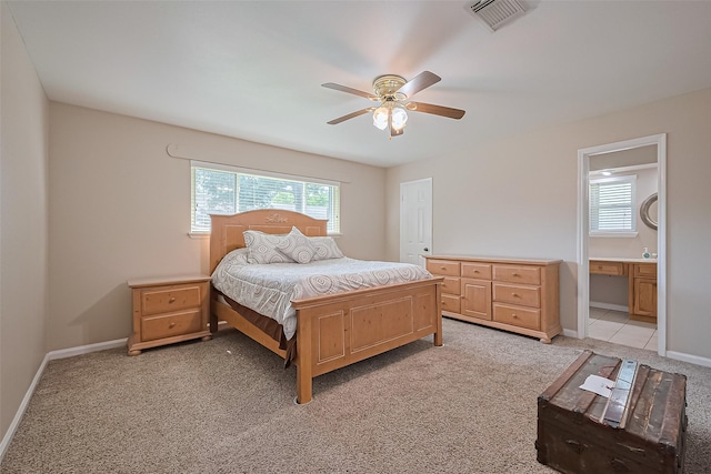22303 Walnut Valley Dr, Spring, TX 77389 - bedroom featuring light carpet, a ceiling fan, and connected bathroom