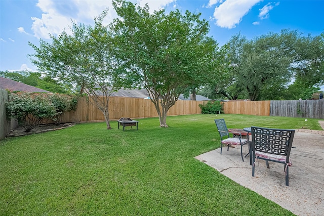 22303 Walnut Valley Dr, Spring, TX 77389 - fenced backyard with an outdoor fire pit and a patio area