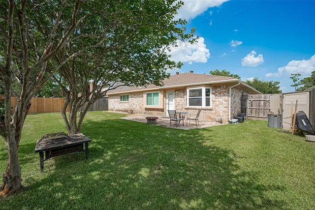 22303 Walnut Valley Dr, Spring, TX 77389 - back of house with a fenced backyard, a patio, brick siding, and a gate