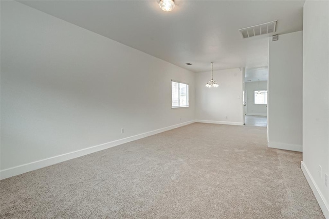 11920 Princess Garden Way, Houston, TX 77047 - unfurnished room with light colored carpet and a chandelier