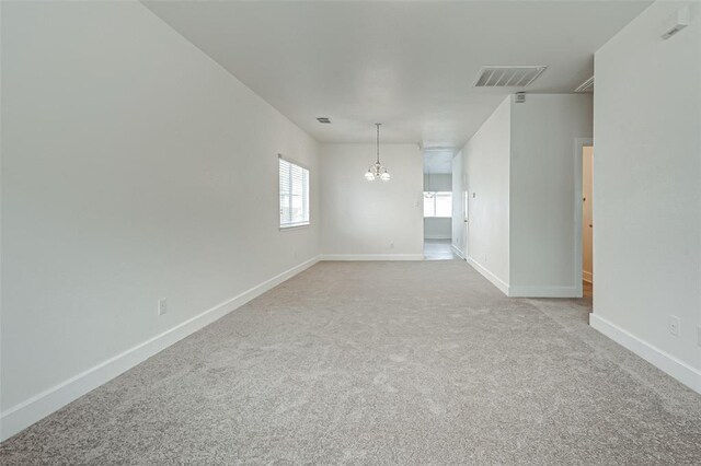 11920 Princess Garden Way, Houston, TX 77047 - carpeted spare room featuring a chandelier and baseboards