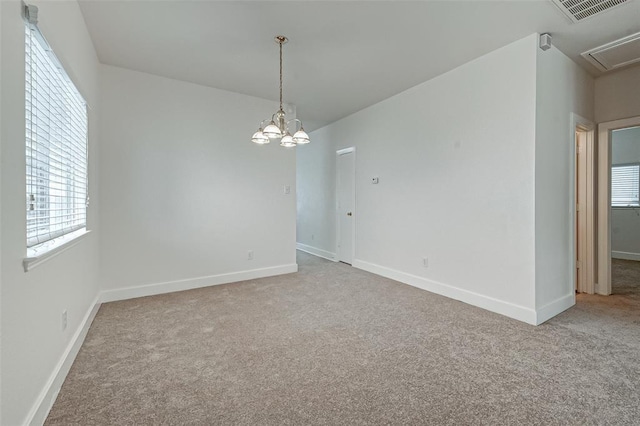 11920 Princess Garden Way, Houston, TX 77047 - empty room with carpet, a chandelier, and attic access