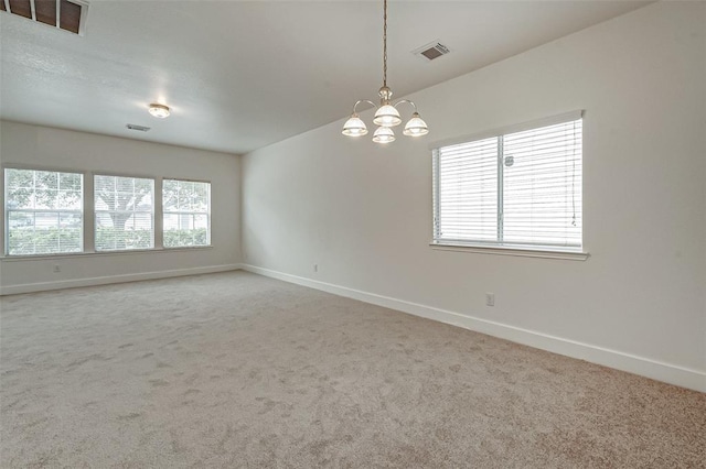 11920 Princess Garden Way, Houston, TX 77047 - carpeted spare room featuring baseboards and a chandelier