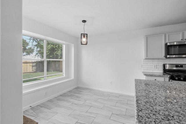 6810 Strathmore Place Ct, Katy, TX 77449 - unfurnished dining area with baseboards