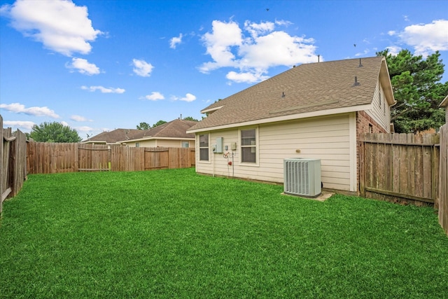 16546 Whitaker Creek Dr, Houston, TX 77095 - back of house with a fenced backyard and a shingled roof