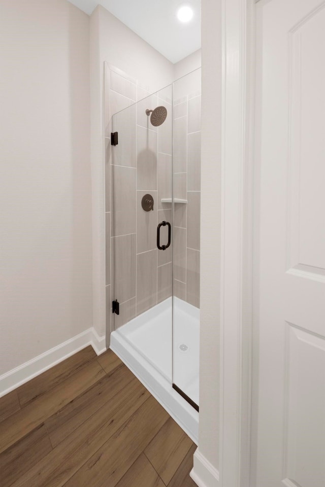 6151 White Spruce Dr, Conroe, TX 77304 - bathroom featuring a shower stall and wood finished floors