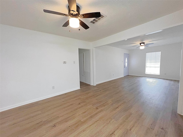 16711 David Glen Dr, Friendswood, TX 77546 - unfurnished room with a ceiling fan and light wood finished floors