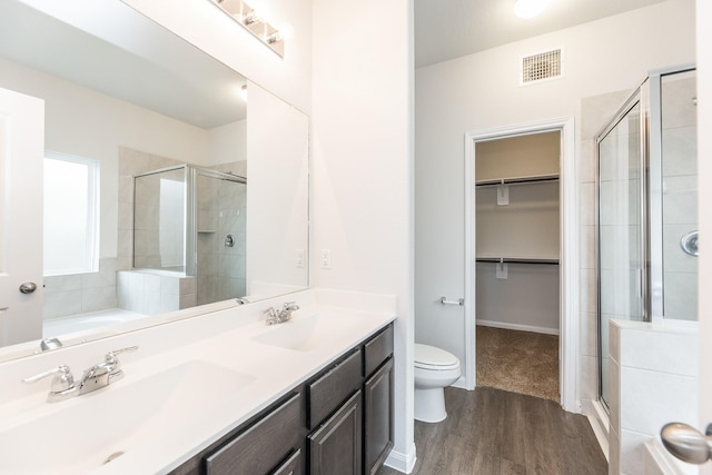 2931 Orchid Ranch Dr, Katy, TX 77494 - full bath featuring a shower stall, wood finished floors, a walk in closet, and double vanity