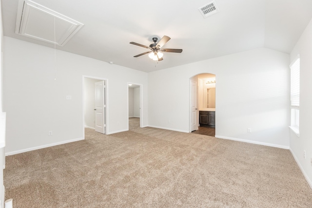 2931 Orchid Ranch Dr, Katy, TX 77494 - unfurnished bedroom featuring attic access, carpet, connected bathroom, arched walkways, and a ceiling fan