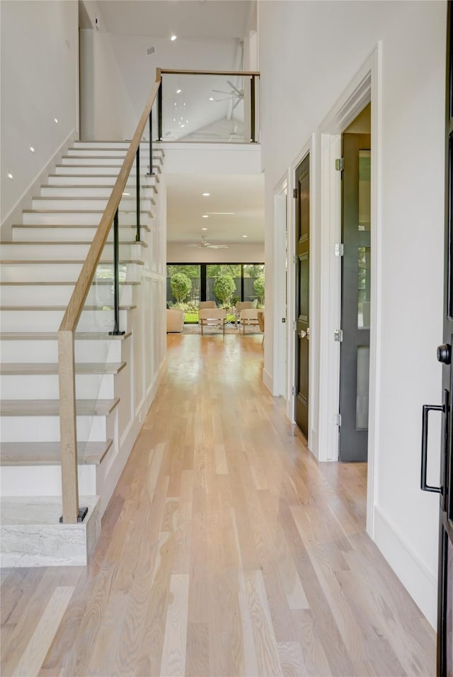 962 Lamonte Ln, Houston, TX 77018 - entrance foyer with stairs, light wood finished floors, ceiling fan, a high ceiling, and recessed lighting