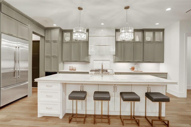 962 Lamonte Ln, Houston, TX 77018 - kitchen featuring built in refrigerator, a chandelier, ventilation hood, light wood finished floors, and recessed lighting