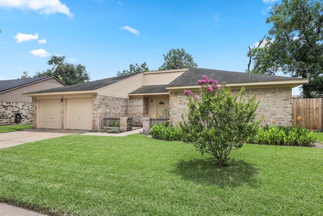 3009 Stacy Ln, Deer Park, TX 77536 - ranch-style home featuring brick siding, a garage, and concrete driveway