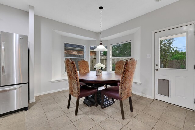 2331 Fern Bend Ln, Katy, TX 77494 - dining area featuring baseboards and light tile patterned floors