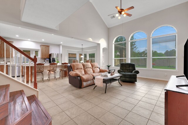 2331 Fern Bend Ln, Katy, TX 77494 - living area featuring light tile patterned flooring, ceiling fan, high vaulted ceiling, stairs, and recessed lighting