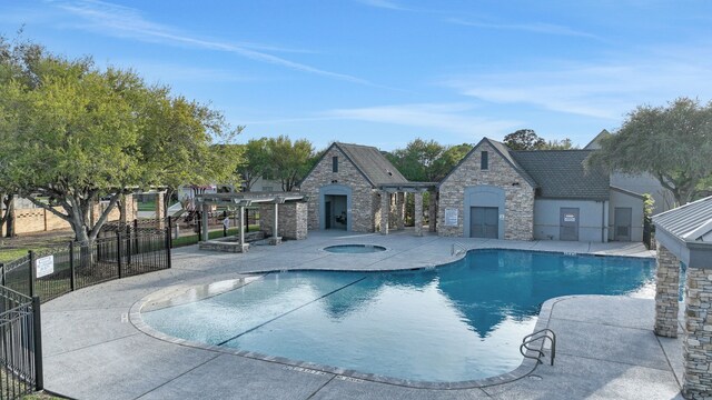 2331 Fern Bend Ln, Katy, TX 77494 - community pool featuring a community hot tub, a patio area, and a pergola