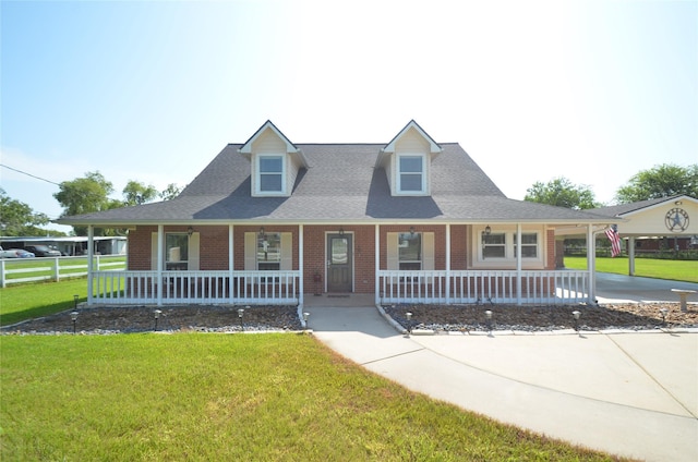 15432 Atwood Ln, Crosby, TX 77532 - view of front of home featuring a porch, brick siding, a shingled roof, and a carport
