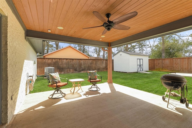 3319 Shadowcrest Ln, Spring, TX 77380 - fenced backyard with a ceiling fan, a shed, a patio, and grilling area
