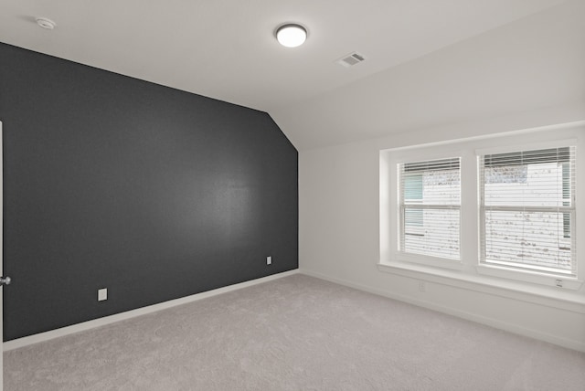 2722 Woodforest Pkwy N, Montgomery, TX 77316 - additional living space featuring vaulted ceiling and light carpet