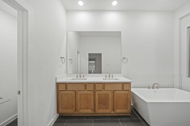 2722 Woodforest Pkwy N, Montgomery, TX 77316 - bathroom with a freestanding tub, double vanity, tile patterned floors, and recessed lighting