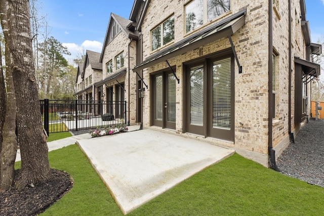 2722 Woodforest Pkwy N, Montgomery, TX 77316 - rear view of house with brick siding and a patio area