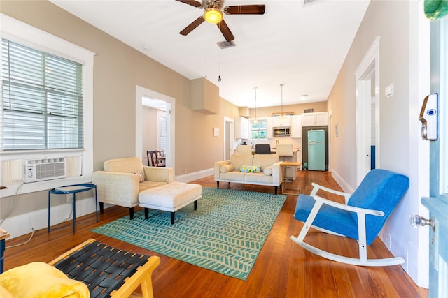 912 Sealy St, Galveston, TX 77550 - living area featuring ceiling fan, light wood-style floors, and cooling unit