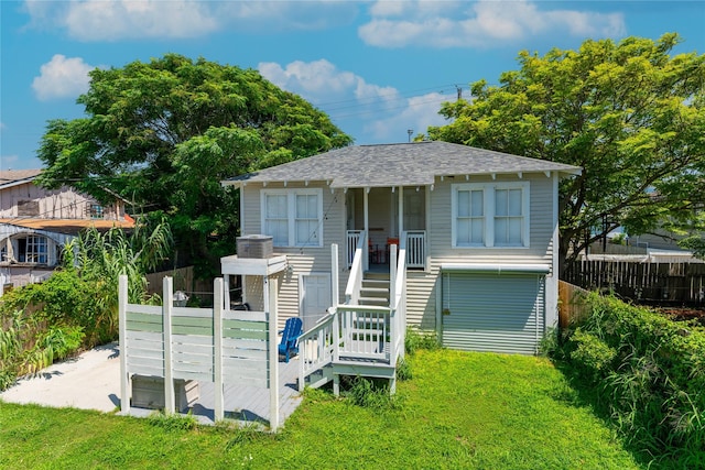 912 Sealy St, Galveston, TX 77550 - view of front of home featuring stairway, a shingled roof, and covered porch