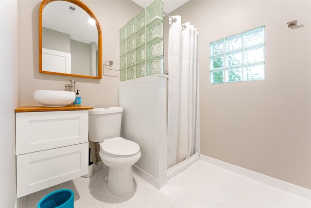 912 Sealy St, Galveston, TX 77550 - bathroom featuring tile patterned flooring, vanity, and a shower with curtain