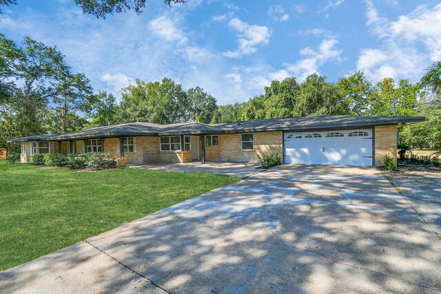 1805 E Ave, Katy, TX 77493 - single story home with driveway, a front lawn, and an attached garage