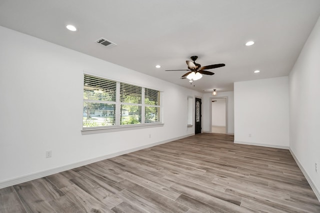 1805 E Ave, Katy, TX 77493 - unfurnished room with recessed lighting, light wood-style floors, and a ceiling fan