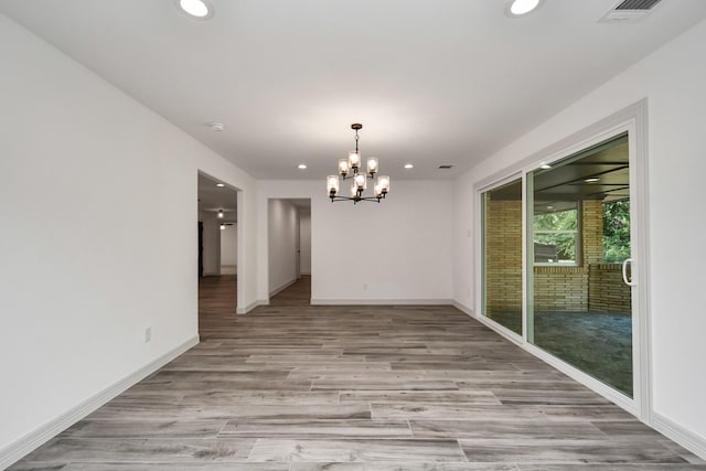 1805 E Ave, Katy, TX 77493 - unfurnished dining area featuring recessed lighting, a chandelier, and light wood-style floors