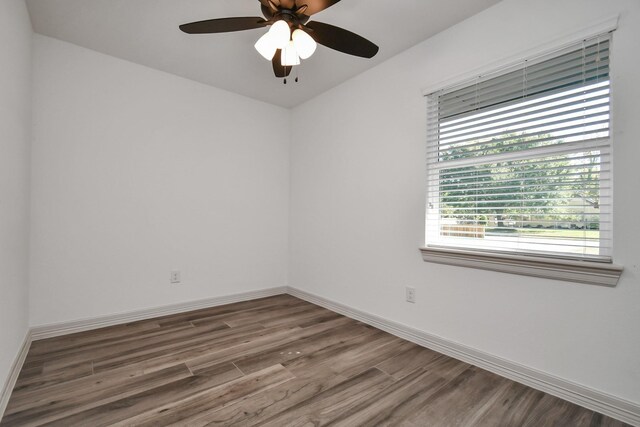 1805 E Ave, Katy, TX 77493 - spare room featuring wood finished floors and a ceiling fan