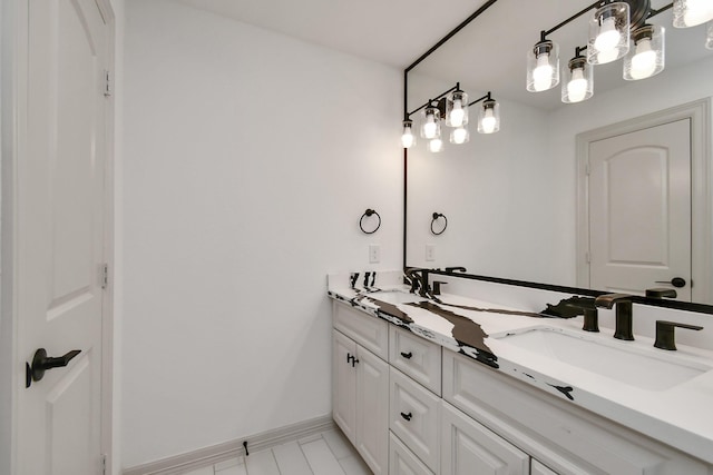 1805 E Ave, Katy, TX 77493 - bathroom with double vanity and baseboards