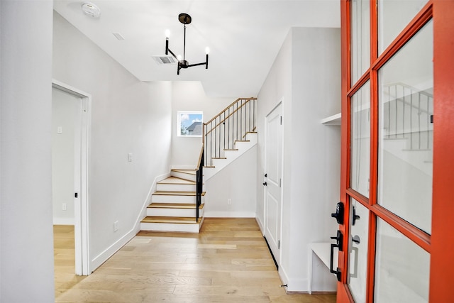 2206 Lou Ellen Ln Unit C, Houston, TX 77018 - foyer entrance with stairway, light wood finished floors, and a chandelier