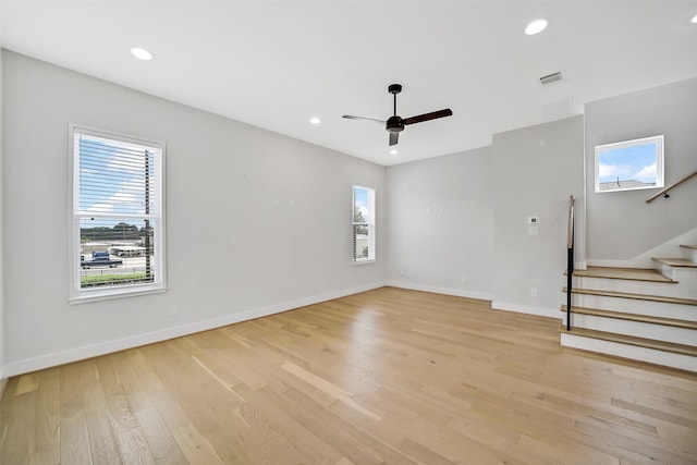 2206 Lou Ellen Ln Unit C, Houston, TX 77018 - empty room with light wood finished floors, stairs, a ceiling fan, and recessed lighting