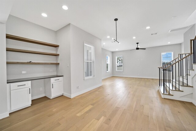2206 Lou Ellen Ln Unit C, Houston, TX 77018 - bar area with stairway, a ceiling fan, light wood-style flooring, recessed lighting, and hanging light fixtures