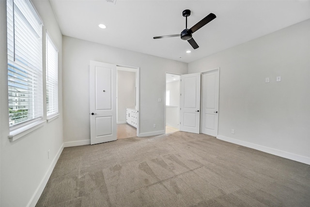 2206 Lou Ellen Ln Unit C, Houston, TX 77018 - unfurnished bedroom featuring multiple windows, carpet floors, recessed lighting, a ceiling fan, and connected bathroom