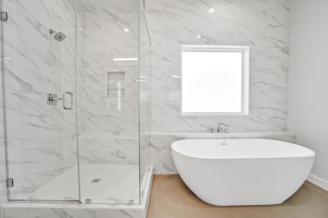 2206 Lou Ellen Ln Unit C, Houston, TX 77018 - full bath with a freestanding tub, a marble finish shower, and tile patterned floors
