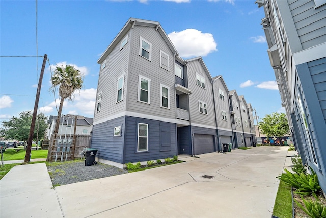 2206 Lou Ellen Ln Unit C, Houston, TX 77018 - view of building exterior with a residential view, driveway, and a garage
