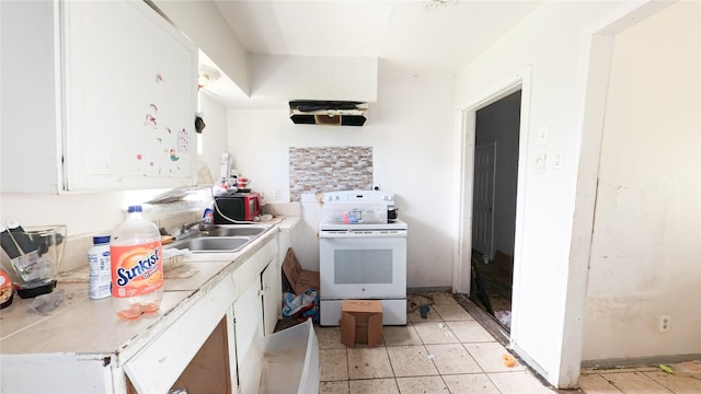 10506 Rosehaven Dr, Houston, TX 77051 - kitchen with white electric range oven, white cabinets, and light countertops