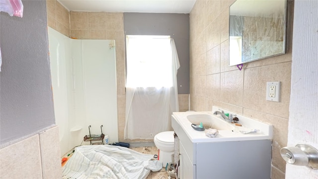 10506 Rosehaven Dr, Houston, TX 77051 - bathroom with tile walls, vanity, and a shower