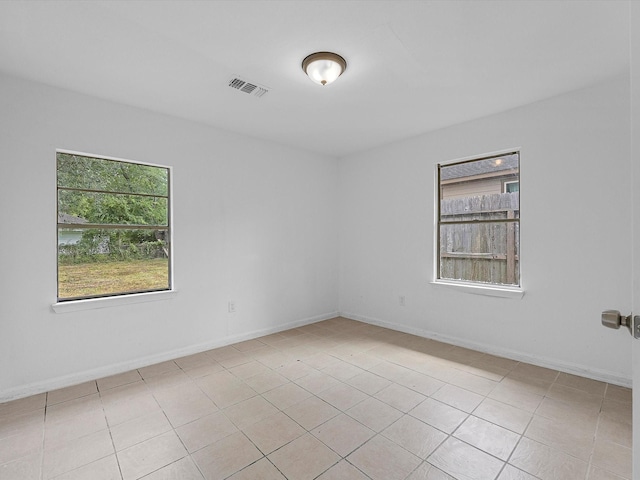 8161 Record St, Houston, TX 77028 - unfurnished room featuring plenty of natural light and light tile patterned floors