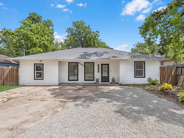 8161 Record St, Houston, TX 77028 - view of front of house featuring roof with shingles and driveway