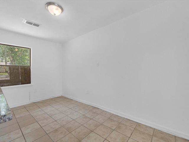 8161 Record St, Houston, TX 77028 - empty room featuring light tile patterned floors and baseboards
